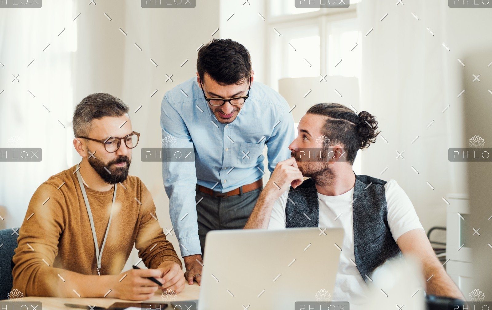 Group Of Young Businesspeople With Laptop Working 8SHTZUN